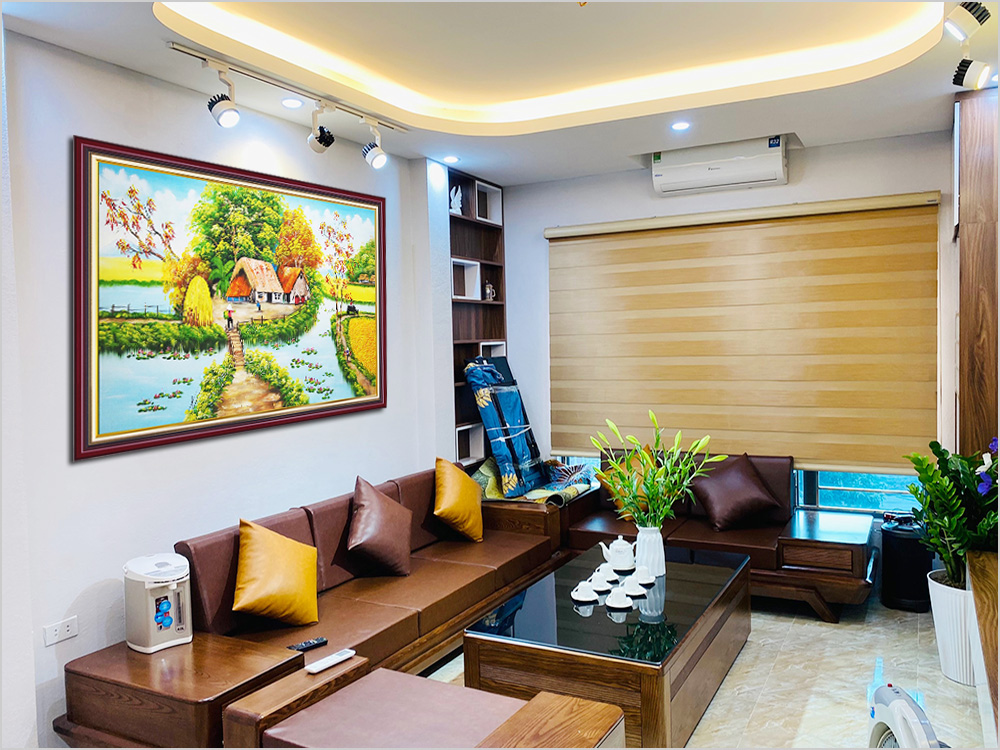 buc tranh ve ha noi tren sofa co nem